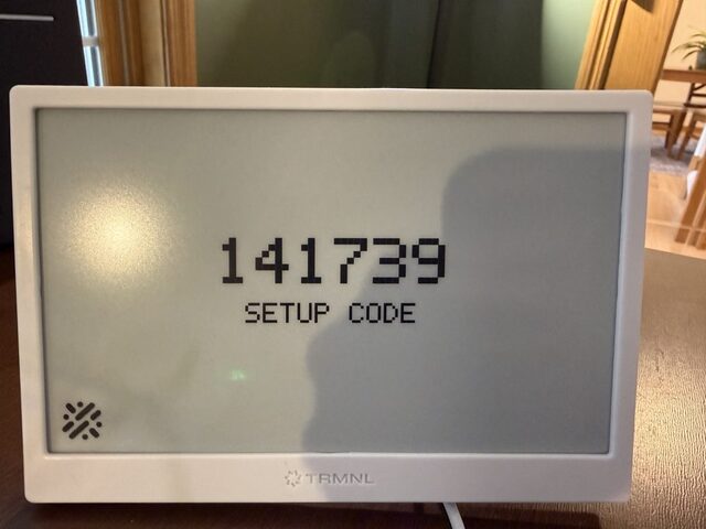 Device screen showing a 6-digit setup code